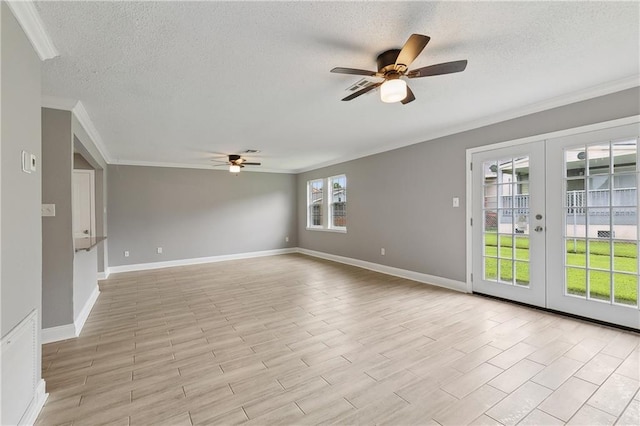 spare room with crown molding, a textured ceiling, ceiling fan, and french doors