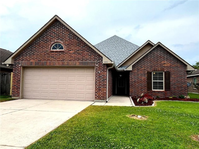 11601 Mary Lee Dr, Denham Springs, LA 70726 - single story home with a shingled roof, an attached garage, brick siding, a front yard, and concrete driveway