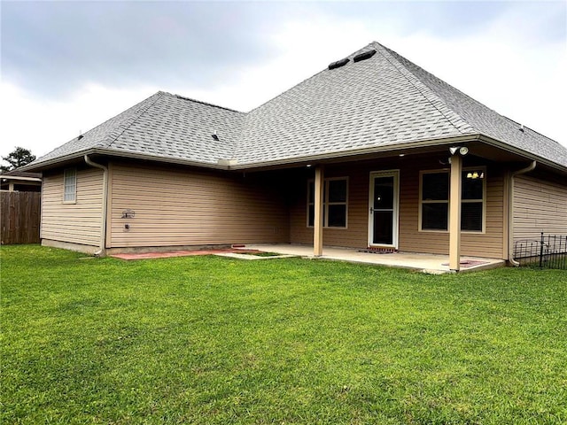 11601 Mary Lee Dr, Denham Springs, LA 70726 - back of house with fence, a lawn, a patio area, and roof with shingles