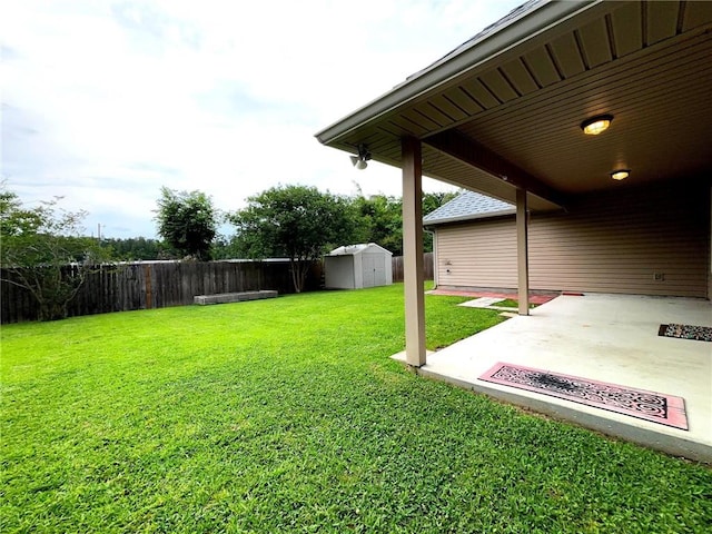 11601 Mary Lee Dr, Denham Springs, LA 70726 - view of yard featuring a storage shed, a patio, an outbuilding, and a fenced backyard