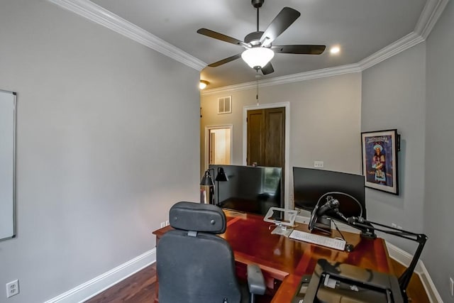 office featuring crown molding, baseboards, ceiling fan, and visible vents