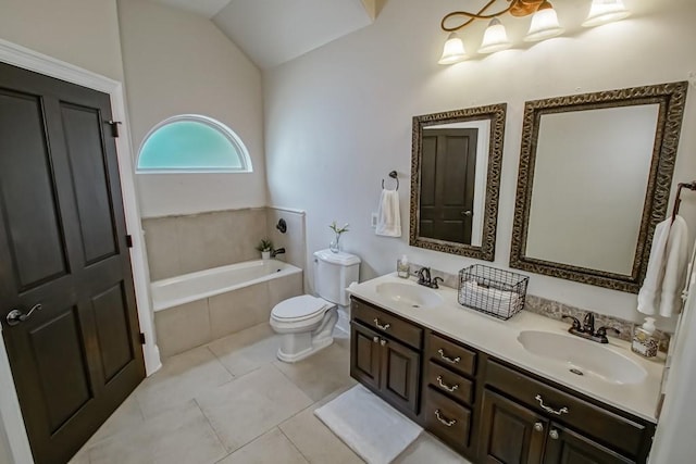 bathroom featuring a sink, tile patterned flooring, a garden tub, and toilet