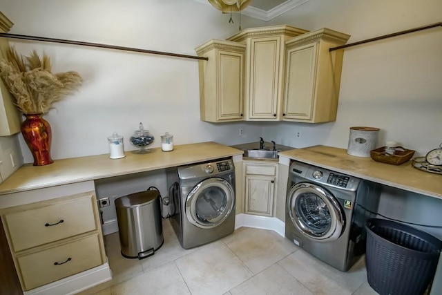 clothes washing area featuring cabinet space, light tile patterned floors, washing machine and dryer, and a sink