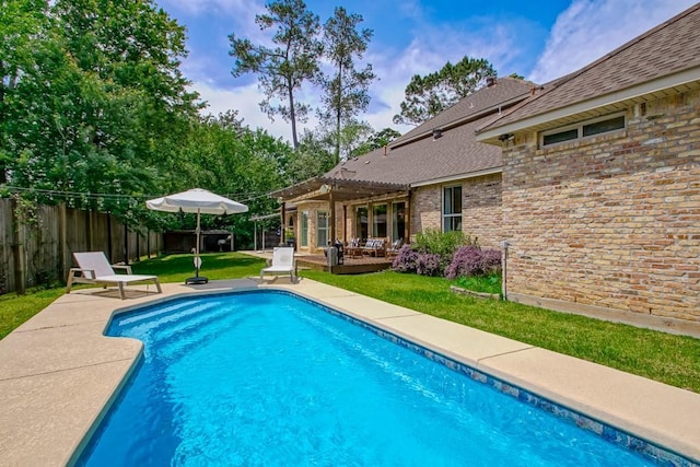 view of swimming pool with a patio, fence, a fenced in pool, a yard, and a pergola