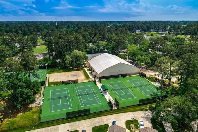 drone / aerial view featuring a view of trees