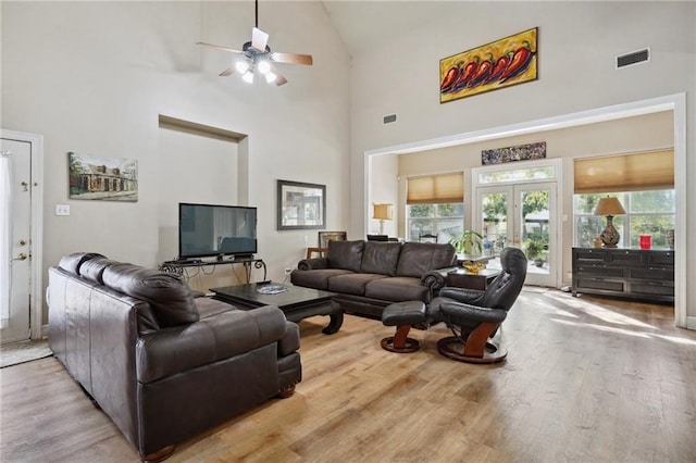 310 Orpheum Ave, Metairie, LA 70005 - living area with visible vents, wood finished floors, a wealth of natural light, and high vaulted ceiling