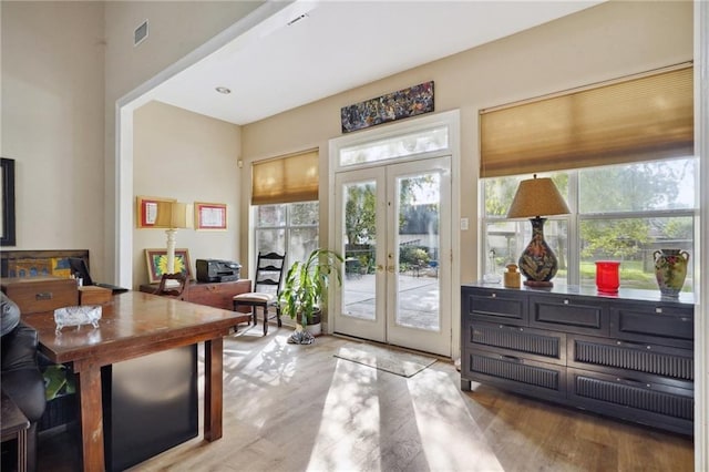 310 Orpheum Ave, Metairie, LA 70005 - doorway to outside with a healthy amount of sunlight, wood finished floors, and visible vents