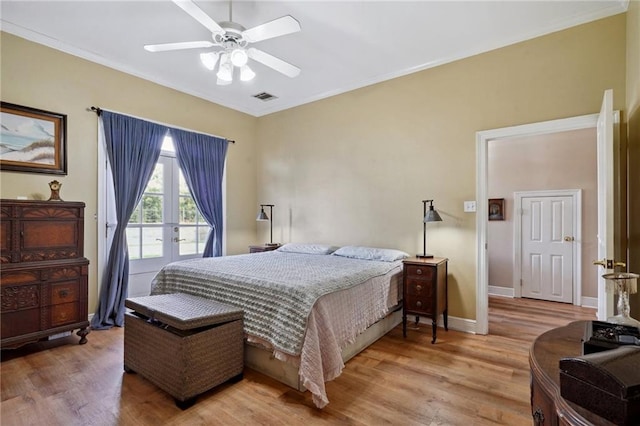 310 Orpheum Ave, Metairie, LA 70005 - bedroom with crown molding, light wood-style flooring, and visible vents