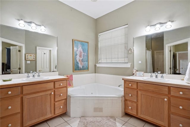 310 Orpheum Ave, Metairie, LA 70005 - bathroom featuring a sink, tile patterned floors, a garden tub, and two vanities