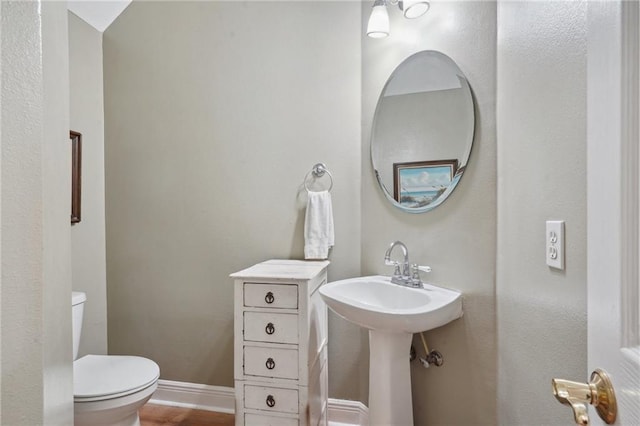 310 Orpheum Ave, Metairie, LA 70005 - bathroom featuring toilet and wood finished floors