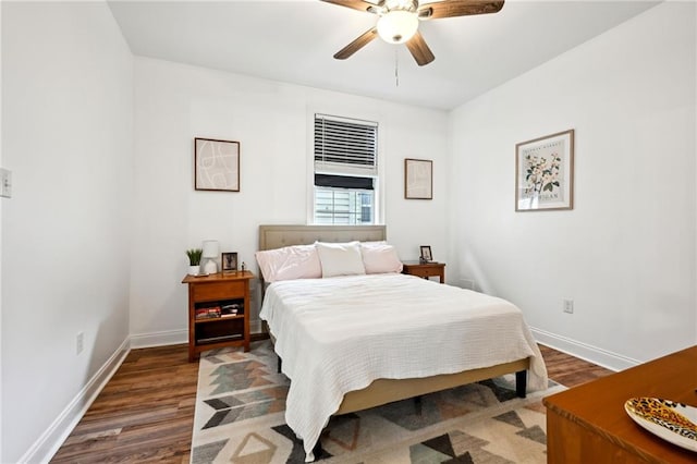 3301 Loyola Ave, New Orleans, LA 70115 - bedroom featuring baseboards, a ceiling fan, and wood finished floors
