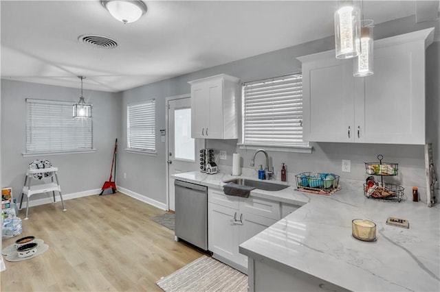 620 Maryland Ave, Metairie, LA 70003 - kitchen with a sink, white cabinets, stainless steel dishwasher, visible vents, and light stone counters