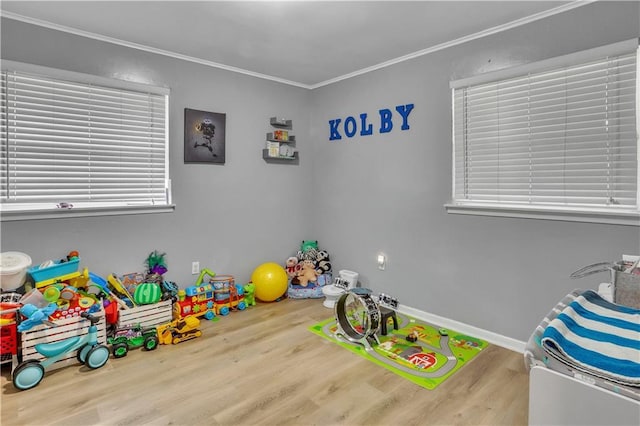 620 Maryland Ave, Metairie, LA 70003 - game room featuring crown molding, baseboards, and wood finished floors