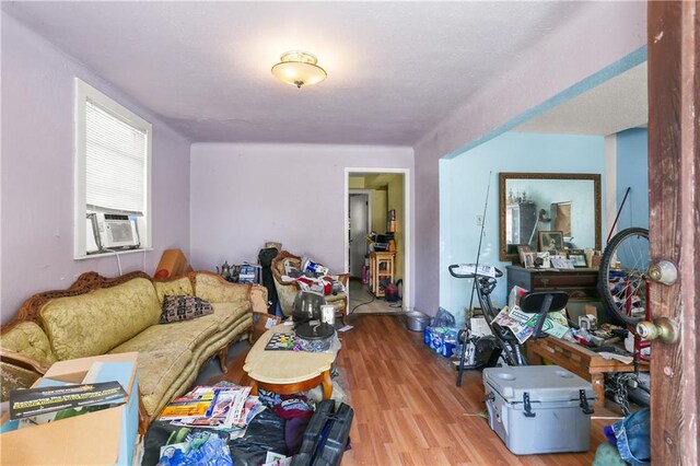 1717 Foucher St, New Orleans, LA 70115 - living room featuring cooling unit and wood finished floors