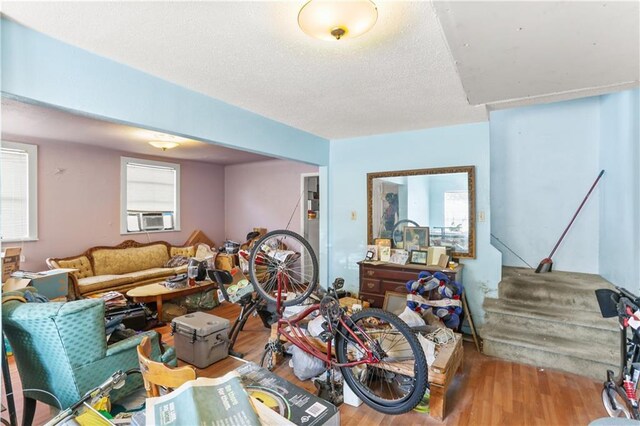 1717 Foucher St, New Orleans, LA 70115 - interior space featuring a healthy amount of sunlight, wood finished floors, and cooling unit