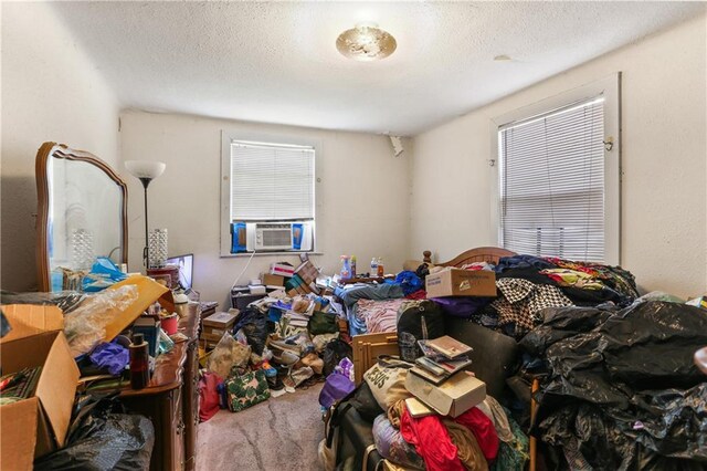 1717 Foucher St, New Orleans, LA 70115 - carpeted bedroom with a textured ceiling and cooling unit