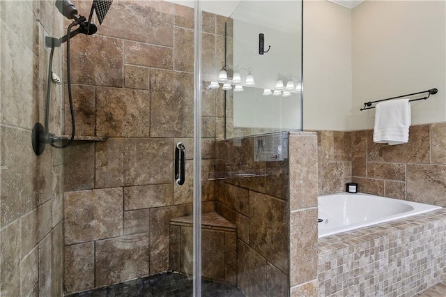 bathroom with a bath and a shower stall