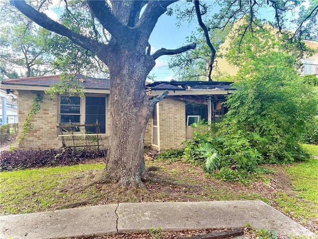 view of front of home featuring brick siding