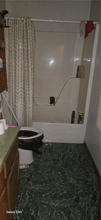 bathroom with vanity, shower / bath combination with curtain, and toilet