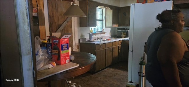 kitchen featuring light countertops and a sink