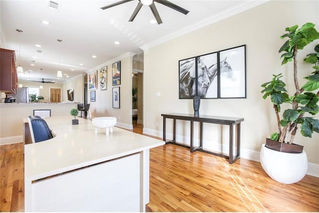 2608 Republic St, New Orleans, LA 70119 - kitchen featuring a ceiling fan, crown molding, light countertops, light wood-type flooring, and recessed lighting