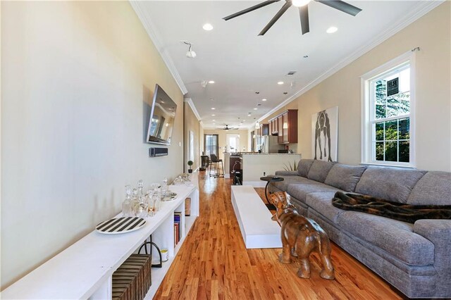 2608 Republic St, New Orleans, LA 70119 - living area with ornamental molding, ceiling fan, light wood finished floors, and recessed lighting