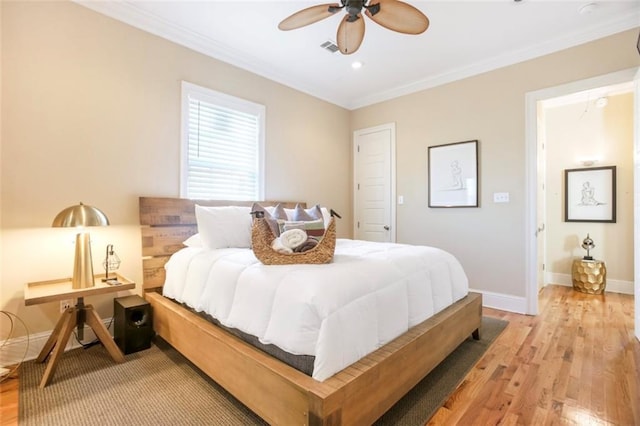 2608 Republic St, New Orleans, LA 70119 - bedroom featuring ornamental molding, light wood-type flooring, baseboards, a ceiling fan, and recessed lighting