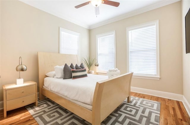 2608 Republic St, New Orleans, LA 70119 - bedroom featuring light wood-style flooring, crown molding, baseboards, and ceiling fan