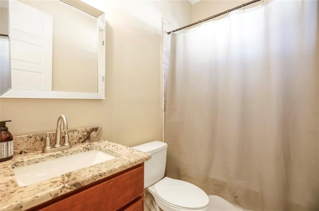 2608 Republic St, New Orleans, LA 70119 - bathroom with toilet, vanity, and a shower with curtain