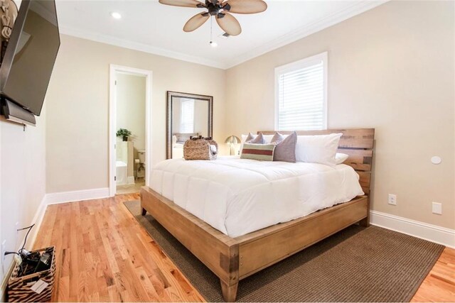 2608 Republic St, New Orleans, LA 70119 - bedroom with light wood-style floors, baseboards, ornamental molding, recessed lighting, and connected bathroom