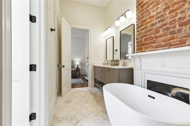 full bath with tile patterned flooring, vanity, ornamental molding, ensuite bathroom, and a soaking tub