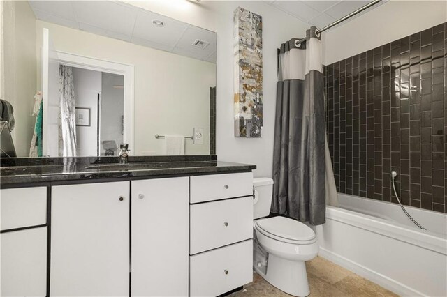 835 Julia St Unit 17, New Orleans, LA 70113 - bathroom with vanity, toilet, tile patterned floors, shower / bathtub combination with curtain, and visible vents