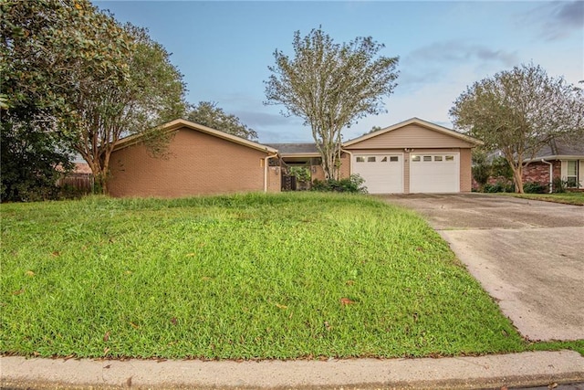 ranch-style house with an attached garage, driveway, and brick siding
