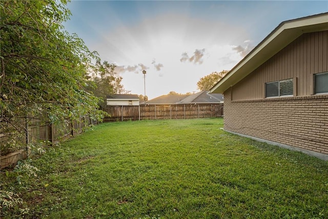 view of yard featuring a fenced backyard