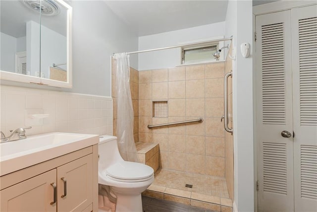 full bath with a closet, a stall shower, and toilet