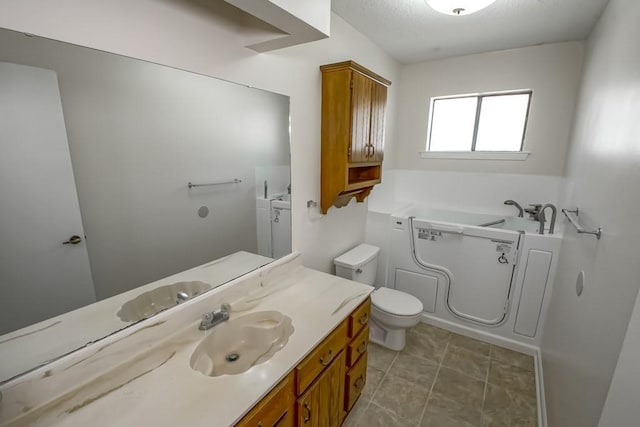 full bath featuring vanity, toilet, and a bath