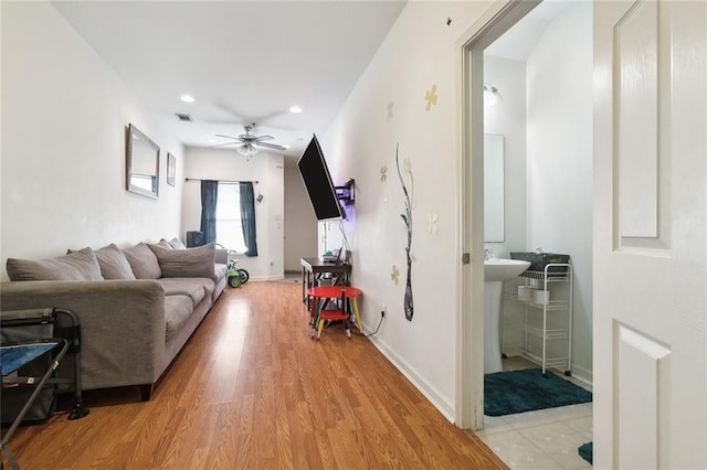 1209 Tallow Tree Ln, Harvey, LA 70058 - living room featuring light wood finished floors, a ceiling fan, baseboards, recessed lighting, and visible vents