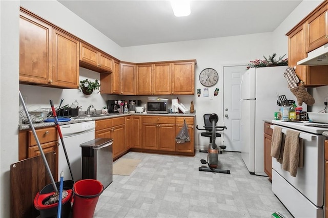 1209 Tallow Tree Ln, Harvey, LA 70058 - kitchen featuring stainless steel microwave, white electric stove, a sink, and brown cabinetry