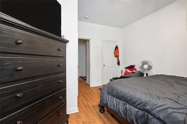 1209 Tallow Tree Ln, Harvey, LA 70058 - bedroom with baseboards and light wood-style flooring