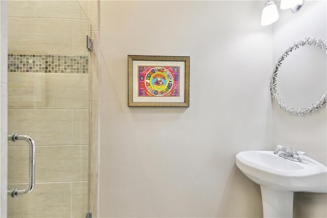 bathroom with a shower stall