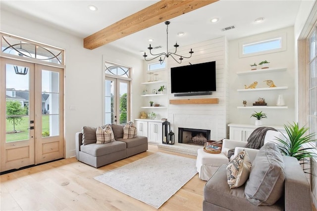 living room featuring light wood finished floors, french doors, recessed lighting, and beam ceiling
