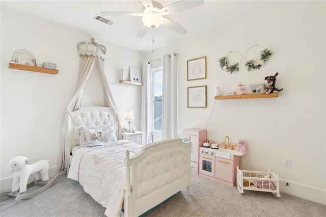 carpeted bedroom with ceiling fan and visible vents