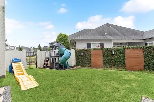 view of yard with a playground and fence