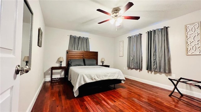 bedroom featuring baseboards, a ceiling fan, and hardwood / wood-style flooring