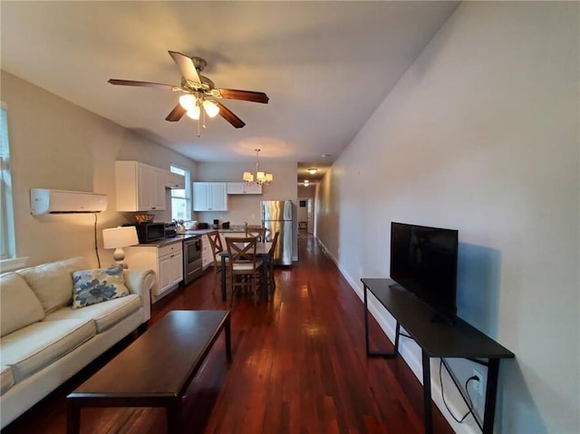 592426 Saint Claude St, New Orleans, LA 70117 - living room with a chandelier, dark wood-style floors, and ceiling fan