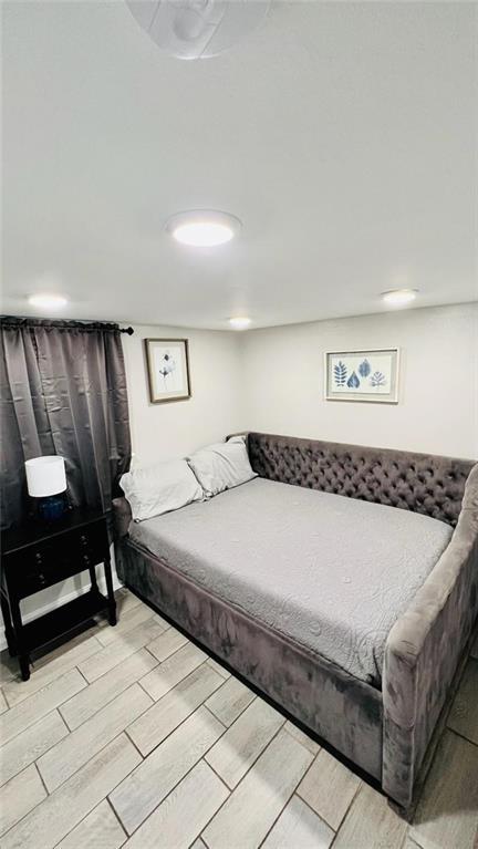 bedroom featuring wood finish floors