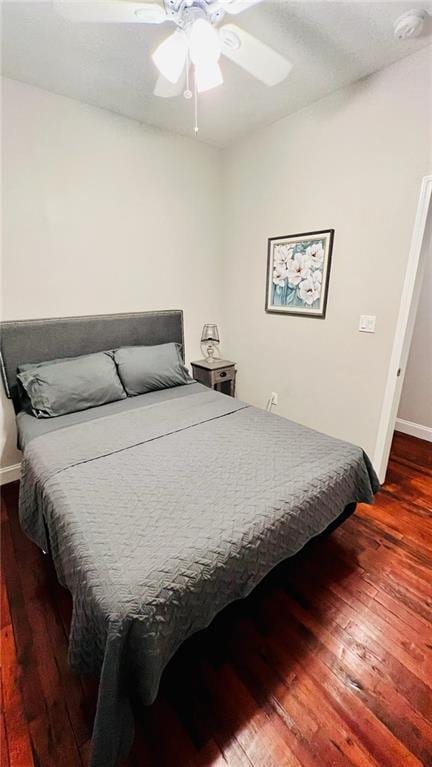 592426 Saint Claude St, New Orleans, LA 70117 - bedroom featuring wood finished floors, baseboards, and ceiling fan