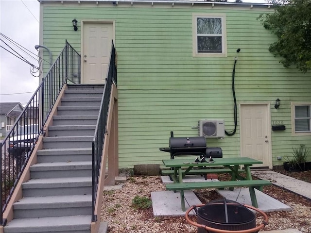 592426 Saint Claude St, New Orleans, LA 70117 - rear view of property featuring a fire pit and stairs
