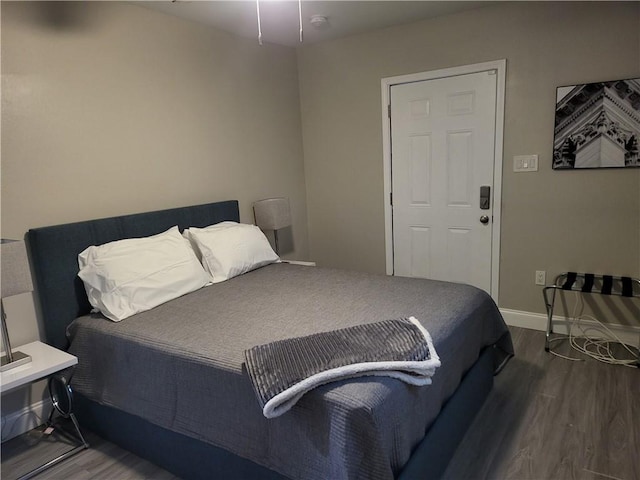 592426 Saint Claude St, New Orleans, LA 70117 - bedroom with wood finished floors and baseboards