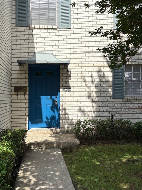 220002 Division St, Metairie, LA 70001 - view of exterior entry featuring brick siding